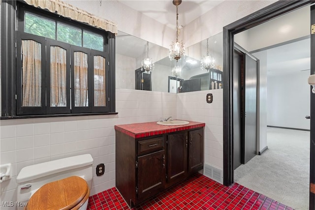 5352 Hills And Dales Rd NW, Canton, OH 44708 - bathroom featuring tile walls, vanity, and a chandelier