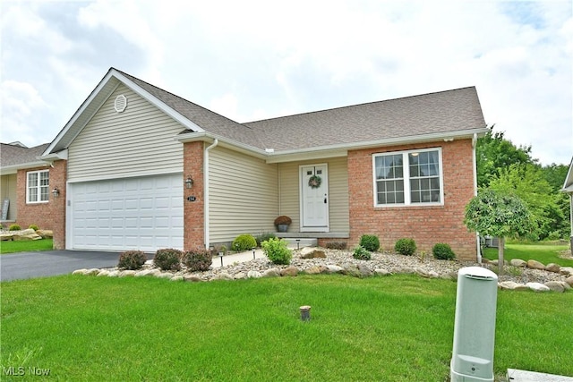 125 Fitch Blvd Unit 254, Youngstown, OH 44515 - view of front of house featuring brick siding, a garage, asphalt driveway, and a front lawn