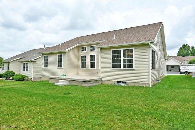 125 Fitch Blvd Unit 254, Youngstown, OH 44515 - back of property featuring a lawn, roof with shingles, and a patio