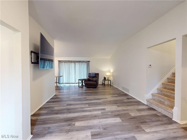 451 Edgewood Cir, Berea, OH 44017 - sitting room featuring wood finished floors, stairs, and vaulted ceiling