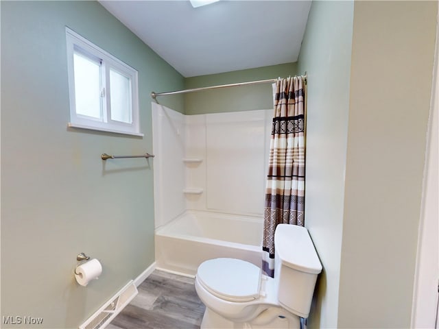 451 Edgewood Cir, Berea, OH 44017 - bathroom with wood finished floors and shower / bath combo with shower curtain