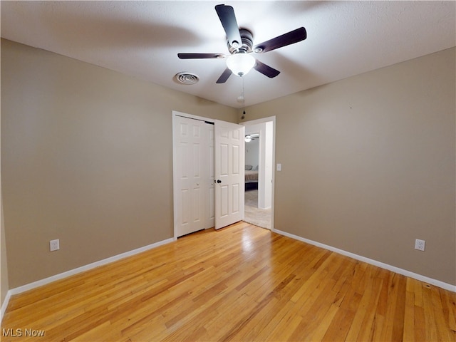451 Edgewood Cir, Berea, OH 44017 - unfurnished bedroom featuring light wood-type flooring, a closet, and ceiling fan