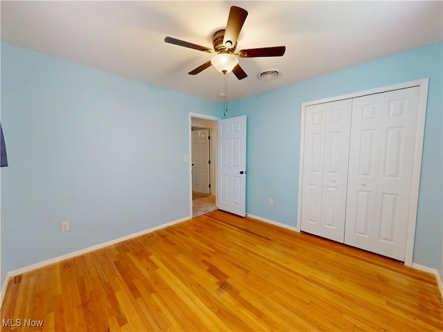 451 Edgewood Cir, Berea, OH 44017 - unfurnished bedroom with light wood-type flooring, a closet, and ceiling fan