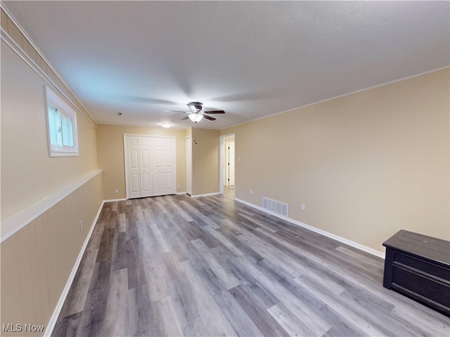 451 Edgewood Cir, Berea, OH 44017 - unfurnished living room with a ceiling fan, wood finished floors, and crown molding