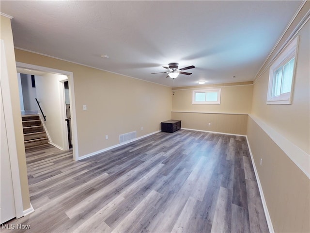 451 Edgewood Cir, Berea, OH 44017 - unfurnished room with a ceiling fan, wood finished floors, stairway, and ornamental molding