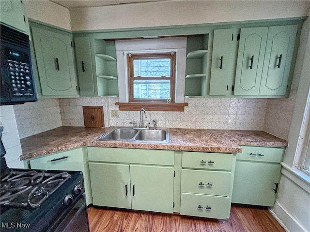 421 E Thornton St, Akron, OH 44311 - kitchen with open shelves, green cabinets, black appliances, and dark wood-type flooring