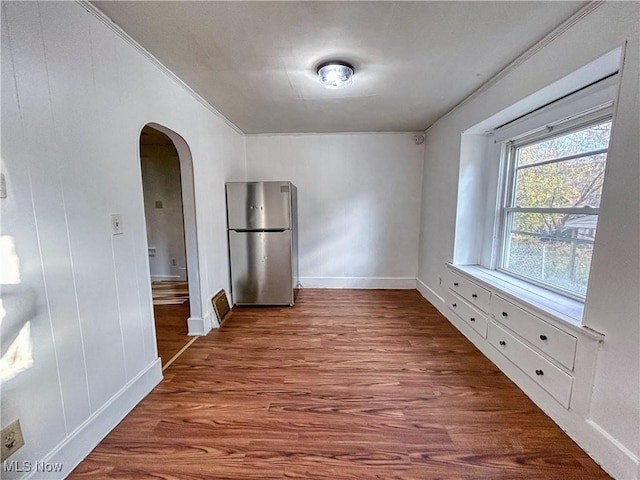 421 E Thornton St, Akron, OH 44311 - unfurnished room with arched walkways, wood finished floors, and crown molding