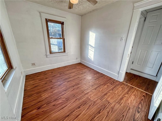 421 E Thornton St, Akron, OH 44311 - unfurnished room featuring wood finished floors, a textured ceiling, and a ceiling fan