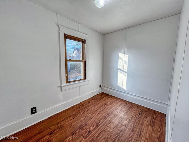 421 E Thornton St, Akron, OH 44311 - empty room featuring wood finished floors and baseboards
