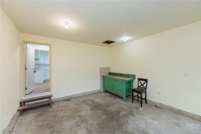 1730 W 20th St, Lorain, OH 44052 - spare room featuring unfinished concrete floors and baseboards