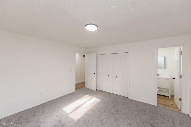 1730 W 20th St, Lorain, OH 44052 - unfurnished bedroom featuring carpet floors, a closet, and ensuite bath