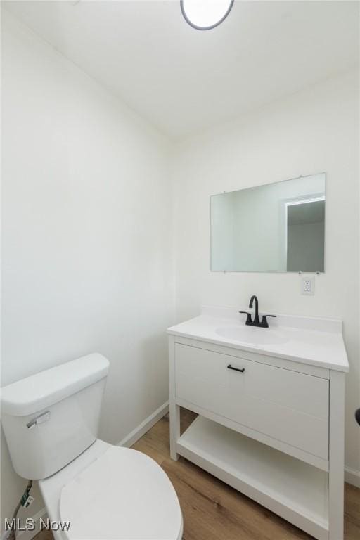 1730 W 20th St, Lorain, OH 44052 - half bathroom with vanity and wood finished floors