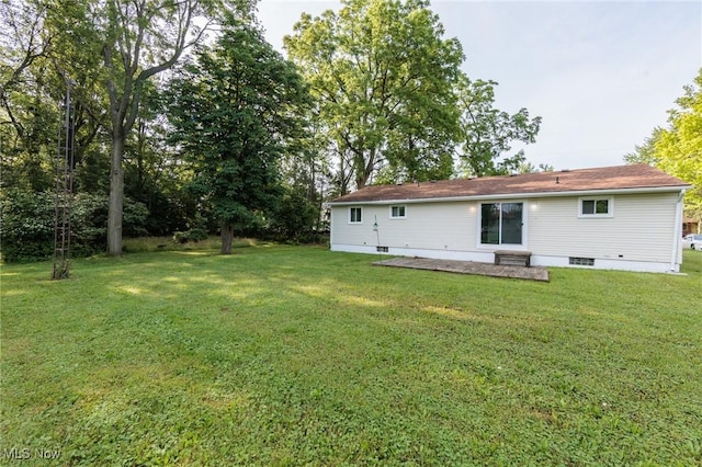 1730 W 20th St, Lorain, OH 44052 - rear view of property featuring a lawn, crawl space, and a patio area