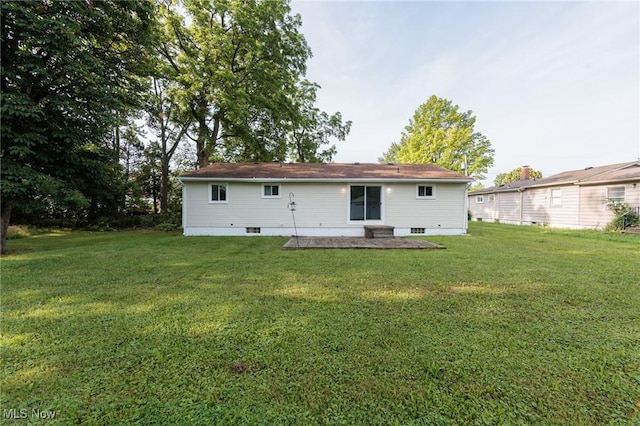 1730 W 20th St, Lorain, OH 44052 - back of property featuring a patio and a lawn