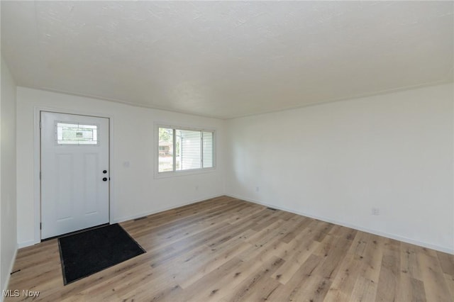 1730 W 20th St, Lorain, OH 44052 - entrance foyer featuring light wood-type flooring and baseboards