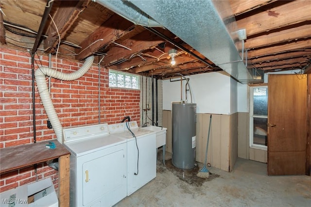 1730 W 20th St, Lorain, OH 44052 - washroom featuring electric water heater, washer and dryer, and brick wall