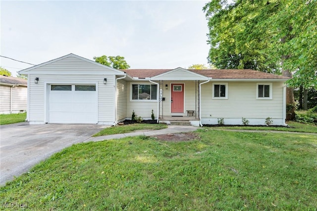 1730 W 20th St, Lorain, OH 44052 - single story home with an attached garage, a front lawn, and concrete driveway