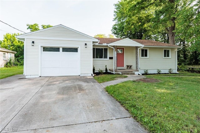 1730 W 20th St, Lorain, OH 44052 - ranch-style house with a front lawn, driveway, and an attached garage