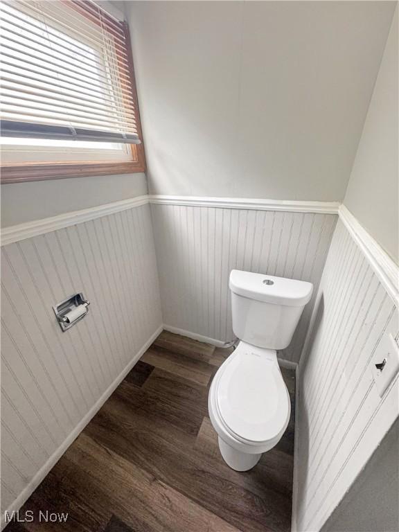 4017 E 54th St, Newburgh Heights, OH 44105 - bathroom featuring wainscoting and wood finished floors
