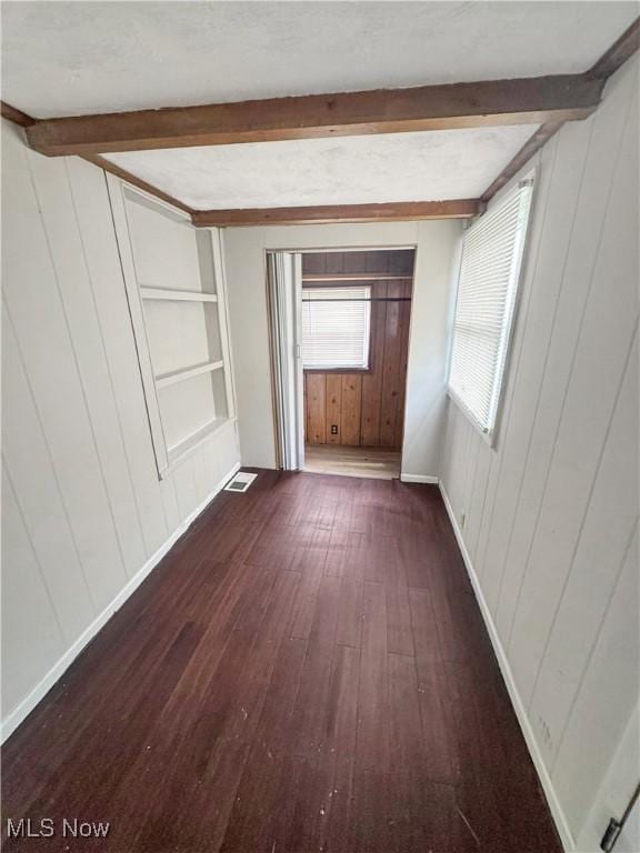 4017 E 54th St, Newburgh Heights, OH 44105 - spare room with hardwood / wood-style flooring, beam ceiling, wooden walls, and built in features
