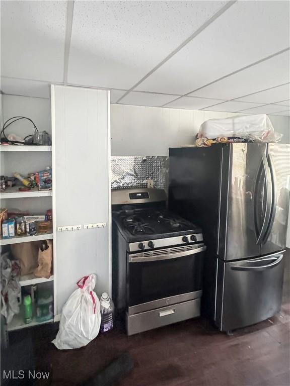 4017 E 54th St, Newburgh Heights, OH 44105 - kitchen featuring appliances with stainless steel finishes and a paneled ceiling