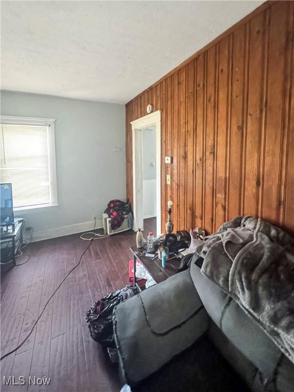 4017 E 54th St, Newburgh Heights, OH 44105 - living room with wood-type flooring and wooden walls