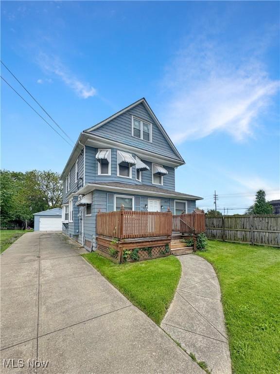 4017 E 54th St, Newburgh Heights, OH 44105 - traditional style home featuring a garage, an outdoor structure, and a deck
