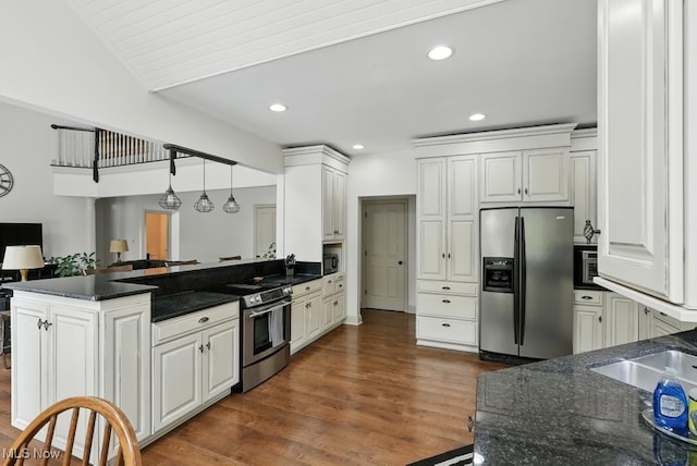 1497 Hunting Hollow Dr, Hudson, OH 44236 - kitchen with appliances with stainless steel finishes, a peninsula, white cabinetry, dark wood-type flooring, and recessed lighting