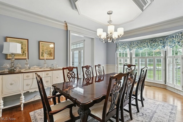 1497 Hunting Hollow Dr, Hudson, OH 44236 - dining area with light wood-style floors, crown molding, a chandelier, french doors, and a raised ceiling