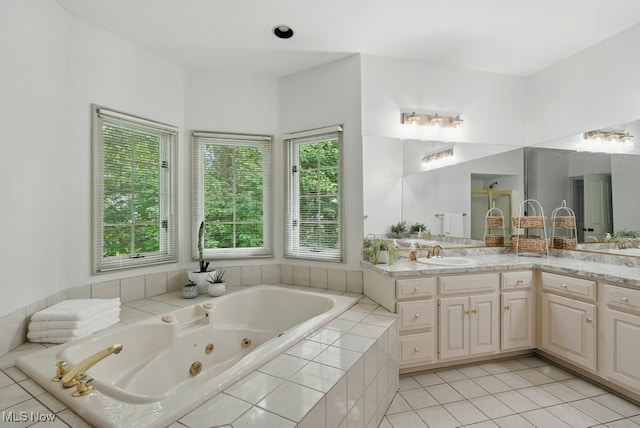 1497 Hunting Hollow Dr, Hudson, OH 44236 - full bathroom with a jetted tub, vanity, and tile patterned floors