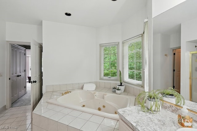 1497 Hunting Hollow Dr, Hudson, OH 44236 - full bathroom featuring a tub with jets, vanity, and tile patterned floors