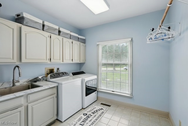 1497 Hunting Hollow Dr, Hudson, OH 44236 - laundry room featuring washer and clothes dryer and cabinet space