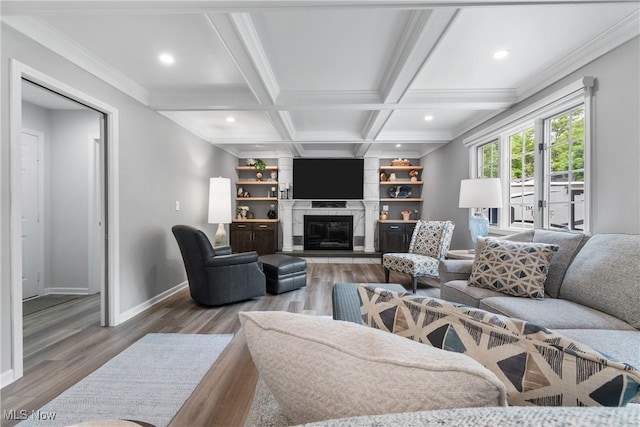 4270 Sir Robert Ave, North Royalton, OH 44133 - living room featuring wood finished floors, recessed lighting, crown molding, a fireplace, and beam ceiling