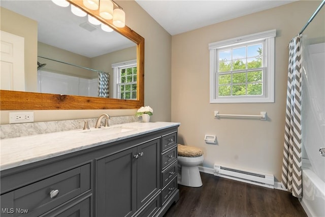 4270 Sir Robert Ave, North Royalton, OH 44133 - bathroom featuring a baseboard radiator, vanity, wood finished floors, and shower / bath combo