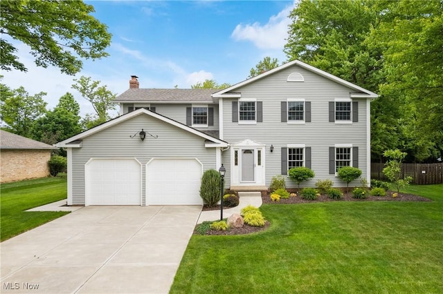 4270 Sir Robert Ave, North Royalton, OH 44133 - view of front of home featuring a chimney, concrete driveway, and an attached garage