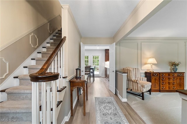 4270 Sir Robert Ave, North Royalton, OH 44133 - entryway with stairway, wood finished floors, ornamental molding, and a decorative wall