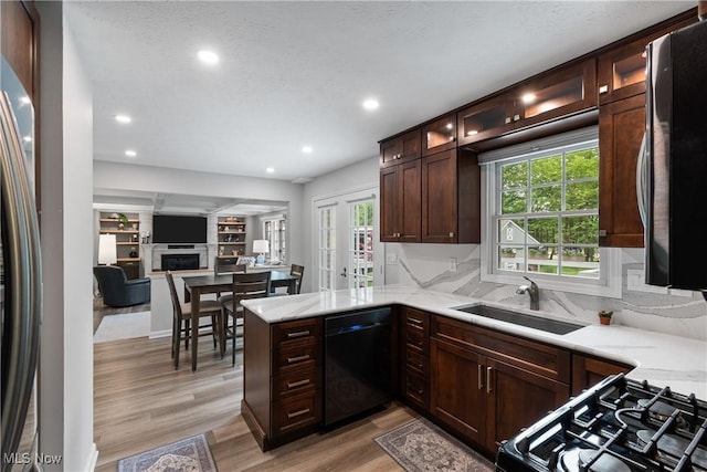 4270 Sir Robert Ave, North Royalton, OH 44133 - kitchen with dishwasher, light wood-type flooring, light stone counters, recessed lighting, and decorative backsplash
