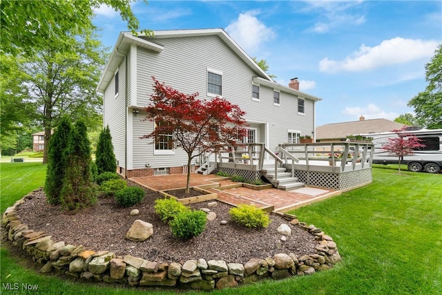 4270 Sir Robert Ave, North Royalton, OH 44133 - back of house with a lawn, a deck, and a chimney