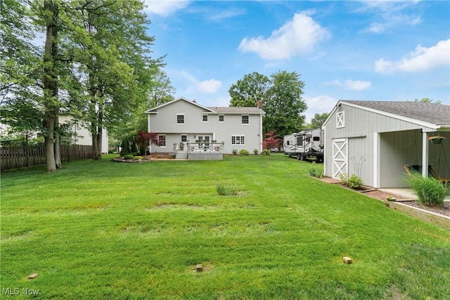 4270 Sir Robert Ave, North Royalton, OH 44133 - rear view of property featuring a wooden deck, an outdoor structure, and a chimney