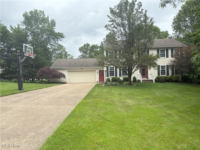 3611 Mark Dr, Broadview Heights, OH 44147 - colonial-style house featuring an attached garage, concrete driveway, and a front lawn