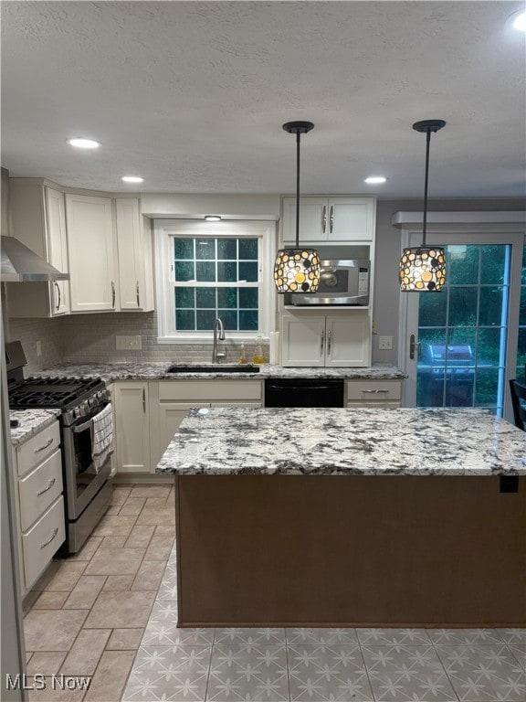 3611 Mark Dr, Broadview Heights, OH 44147 - kitchen with stainless steel appliances, light stone countertops, backsplash, pendant lighting, and recessed lighting