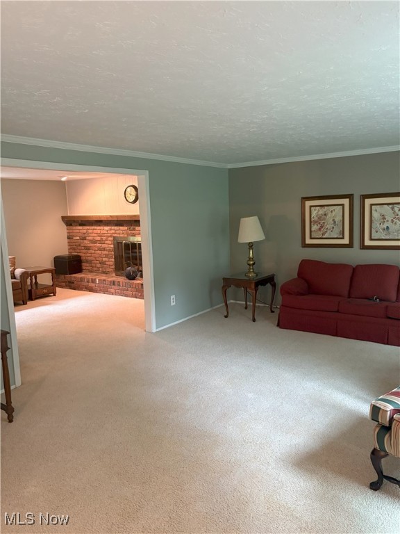3611 Mark Dr, Broadview Heights, OH 44147 - carpeted living room featuring ornamental molding and a textured ceiling