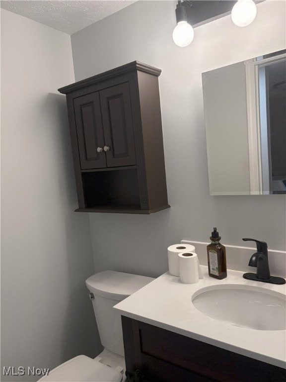 3611 Mark Dr, Broadview Heights, OH 44147 - half bath featuring vanity and a textured ceiling