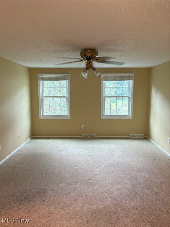 3611 Mark Dr, Broadview Heights, OH 44147 - unfurnished room featuring carpet flooring, a ceiling fan, and a textured ceiling