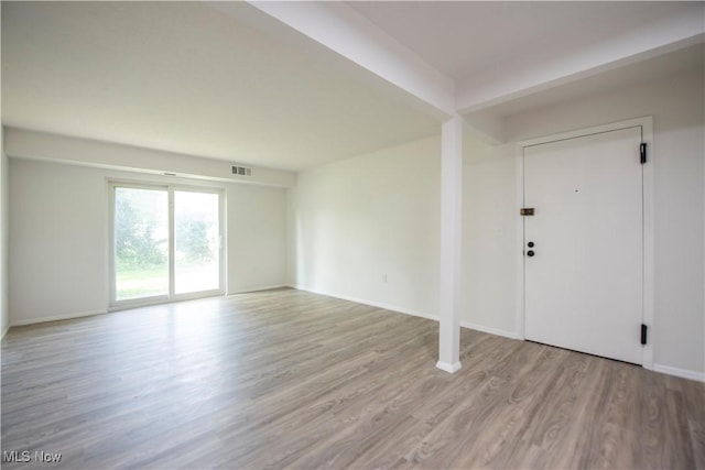 8507 Akins Rd Unit C-2, North Royalton, OH 44133 - unfurnished living room with wood finished floors and baseboards