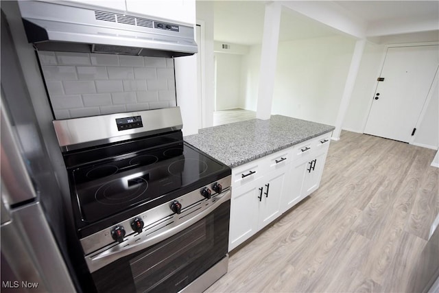 8507 Akins Rd Unit C-2, North Royalton, OH 44133 - kitchen featuring appliances with stainless steel finishes, under cabinet range hood, light wood-style flooring, light stone countertops, and white cabinets
