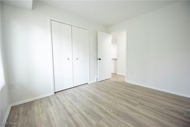 8507 Akins Rd Unit C-2, North Royalton, OH 44133 - unfurnished bedroom featuring wood finished floors and a closet