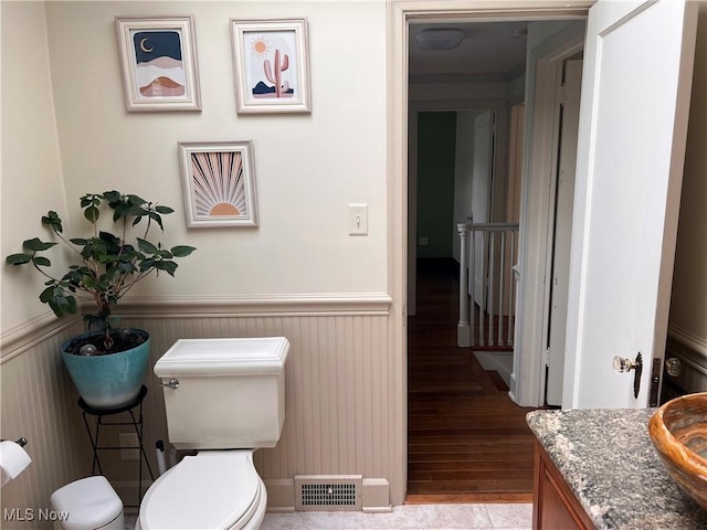 913 Home Cir, Salem, OH 44460 - half bath featuring wainscoting, wood finished floors, and vanity