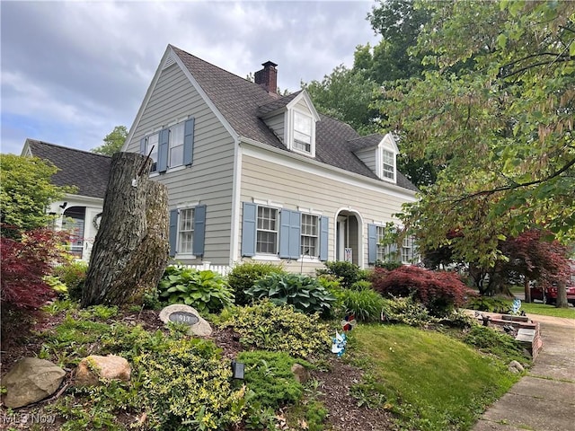 913 Home Cir, Salem, OH 44460 - view of side of property with a chimney and a shingled roof