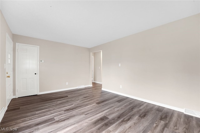 452 E 329th St, Willowick, OH 44095 - empty room featuring dark wood-type flooring and baseboards